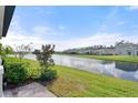 View of a peaceful canal from a backyard patio at 2916 Meleto Blvd, New Smyrna Beach, FL 32168