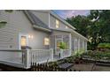 Screened porch and deck, backyard with plants at 5711 John Anderson Hwy, Flagler Beach, FL 32136