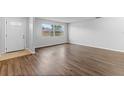 Living room with hardwood floors and a large window at 120 Colina Pl, Ormond Beach, FL 32174