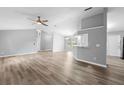 Open concept living room with new flooring, and neutral colors at 2730 Woodland Dr, Edgewater, FL 32141
