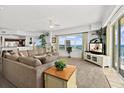 Bright living room boasts ocean views, comfortable seating, and access to a balcony at 1900 N Atlantic Ave # 1601, Daytona Beach, FL 32118