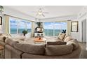 Spacious living room with ocean view, large sectional sofa, and ample natural light at 1900 N Atlantic Ave # 1601, Daytona Beach, FL 32118