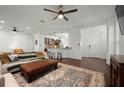 Spacious living room with hardwood floors, comfortable seating, and access to kitchen at 4747 Nw 35Th Lane Rd, Ocala, FL 34482