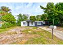 Updated one-story home with a freshly painted exterior and well-maintained landscaping at 1370 Wright St, Daytona Beach, FL 32117