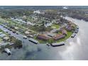 Aerial view of waterfront community with numerous homes and boat docks at 1640 Juno Trl # 205A, Astor, FL 32102