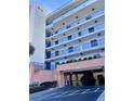 Exterior view of condo building with parking garage at 5300 S Atlantic Ave # 19-502, New Smyrna Beach, FL 32169
