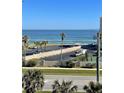 Oceanfront view with parking and tennis court at 5300 S Atlantic Ave # 19-502, New Smyrna Beach, FL 32169