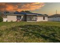Large backyard with solar panels and screened patio at 552 Nardello Dr, Deltona, FL 32725