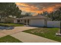 Single-story house with attached garage and driveway, surrounded by green lawn at 552 Nardello Dr, Deltona, FL 32725