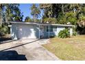 Ranch style home with a large yard and driveway at 1068 North St, Daytona Beach, FL 32114