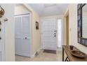 Bright entryway with coat closet and decorative console table at 290 W Sabal Palm Pl # 290, Longwood, FL 32779