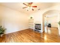 Living room features hardwood floors, a fireplace, and built-in shelves at 1907 Enterprise Osteen Rd, Deltona, FL 32738