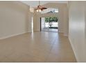 Spacious dining area with tile flooring and access to the backyard at 3164 Wood Rose Way, Deltona, FL 32725