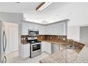 Kitchen features granite countertops and stainless steel appliances at 3190 Lori Ct, Deltona, FL 32738