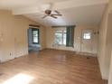 Living room with light wood floors and a ceiling fan at 1632 Bream Dr, Seville, FL 32190
