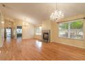 Living room with hardwood floors, fireplace and two chandeliers at 22 Old Macon Dr, Ormond Beach, FL 32174