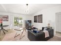 Living room with access to the backyard and modern decor at 2928 Bristol Ln, South Daytona, FL 32119