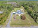 House on a large lot with surrounding trees at 3782 Pine Cone Ln, Ormond Beach, FL 32174