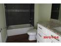 Bathroom featuring a bathtub, toilet, and vanity with granite countertops at 2301 9Th Ave, Deland, FL 32724