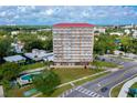 Aerial view of The Landmark, showcasing its location near the water and city at 404 S Beach St # 010 101, Daytona Beach, FL 32114
