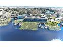Aerial view showing waterfront property with boat slips and a pool at 2329 River Ridge Rd # 13, Deland, FL 32720
