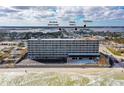 Aerial view of a beachfront hotel with a pool and surrounding areas at 3501 S Atlantic Ave # 2030, Daytona Beach, FL 32118