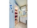 Bathroom with nautical decor, white vanity, and marble shower at 3501 S Atlantic Ave # 2030, Daytona Beach, FL 32118