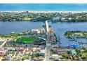 Aerial view of a coastal town with bridge and marina at 633 S Palmetto Ave # 1010, Daytona Beach, FL 32114
