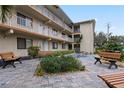 Community patio area with benches and picnic table at 633 S Palmetto Ave # 1010, Daytona Beach, FL 32114