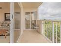 Condo balcony with sliding glass doors and partial living room view at 3 Oceans West Blvd # 4A5, Daytona Beach Shores, FL 32118