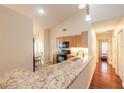 Spacious kitchen with granite countertops and light wood cabinets at 32543 Crystal Breeze Ln, Leesburg, FL 34788