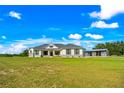 House exterior showcasing a modern farmhouse design at 575 Alderman Rd, Lakeland, FL 33810