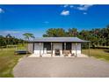 Metal barn with covered parking and ample storage space at 575 Alderman Rd, Lakeland, FL 33810