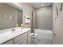 Clean bathroom with a bathtub, shower, and updated vanity at 3022 Ruby Falls Dr, Deland, FL 32724