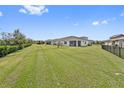 Expansive backyard with lush lawn and privacy fence at 2541 Yellow Brick Rd, Saint Cloud, FL 34772