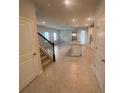 Bright entryway with view of kitchen and stairs at 3868 Denali Dr, Apopka, FL 32712