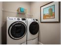 Laundry room with washer, dryer, and overhead shelving at 5769 Anders Way, St Cloud, FL 34771