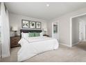 Spacious main bedroom with ensuite bathroom and neutral decor at 2204 Fluorescent Way, South Daytona, FL 32119