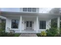 Front view of a farmhouse-style home with a porch at 2719 Brookline Ave, New Smyrna Beach, FL 32168