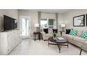 Bright living room with comfy seating and a modern feel at 2314 Incandescent Way, South Daytona, FL 32119