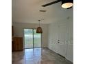 Bright dining area with sliding glass doors at 409 S Lincoln St, Bushnell, FL 33513