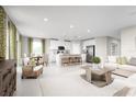 Open living and kitchen area with island and modern furniture at 10937 Sw 73Rd Ct, Ocala, FL 34476