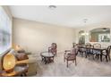 Living room with couches, chairs, and a view of dining area at 5631 Superior Dr, Lakeland, FL 33805