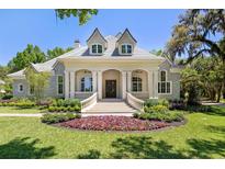 Two-story house with stone facade and landscaped yard at 3923 Nw 85Th Ter, Ocala, FL 34482