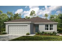 One-story home with gray siding and a two-car garage at 2614 Fernleaf St, Auburndale, FL 33823