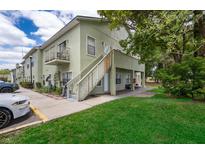 Two-story building with stairs and green landscaping at 5817 La Costa Dr # S, Orlando, FL 32807
