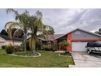 Charming single-story home with a well-maintained lawn at 804 Mountbatten Ln, Kissimmee, FL 34758