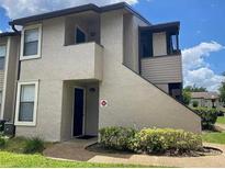Two-story condo building with private entrance and landscaping at 2923 Antique Oaks Cir # 37, Winter Park, FL 32792