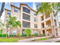 Exterior of the building with landscaping and balconies at 1301 Tuscan Ter # 9401, Davenport, FL 33896