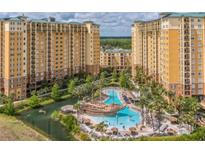 Luxury resort with multiple buildings, pools, and water features at 8101 Resort Village Dr # 3303, Orlando, FL 32821